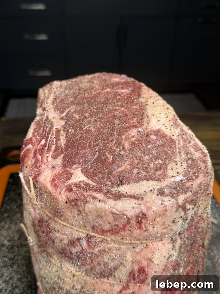 Smoked Prime Rib Roast: Juicy Recipe and Smoking Tips 5 seasoned prime rib on the cutting board