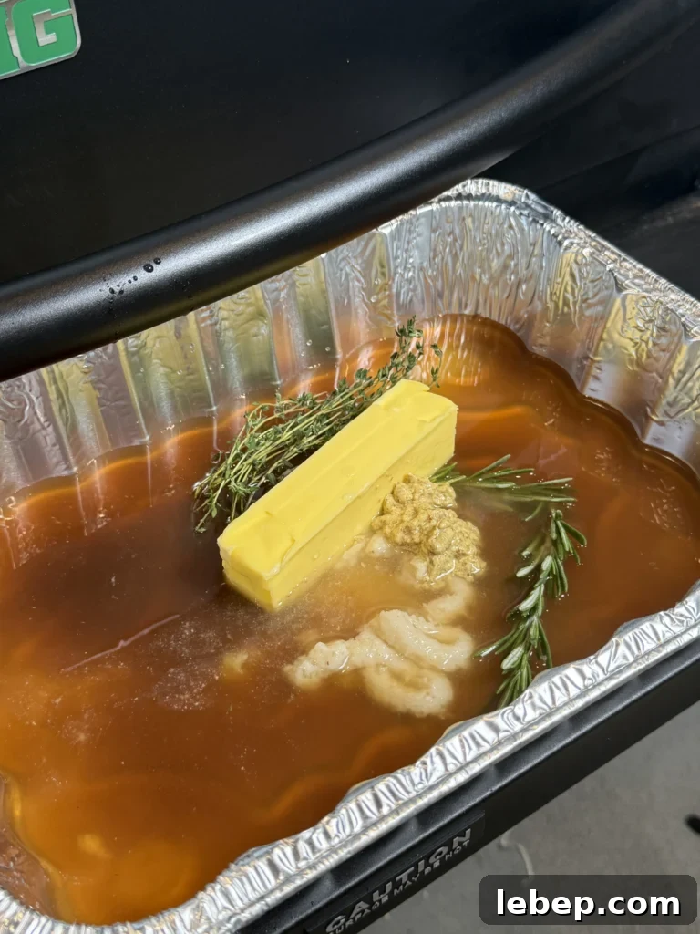 Smoked Prime Rib Roast: Juicy Recipe and Smoking Tips 8 au jus in the pan