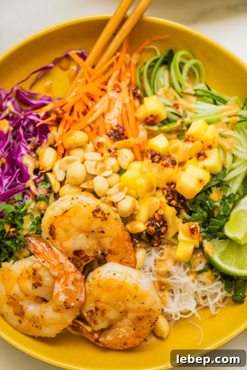 Spring Roll Bowl Recipe: Fresh Vietnamese Salad Bowl with Dipping Sauce 8 close up shot of the spring roll bowl with peanut sauce on top and shrimp