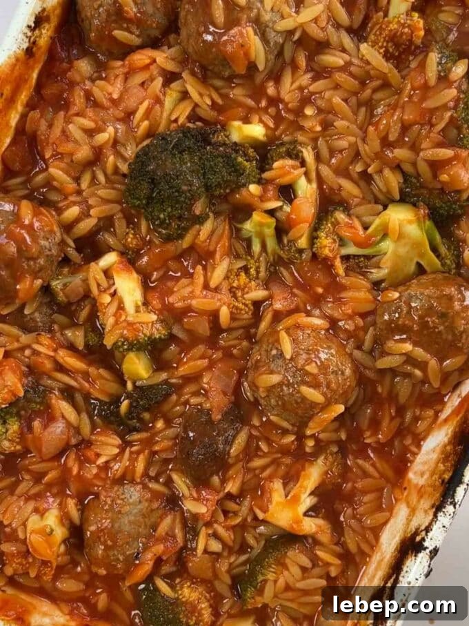 How to make Meatball Orzo Bake, step 3. Cooked orzo, meatballs and broccoli cooked in a dish.