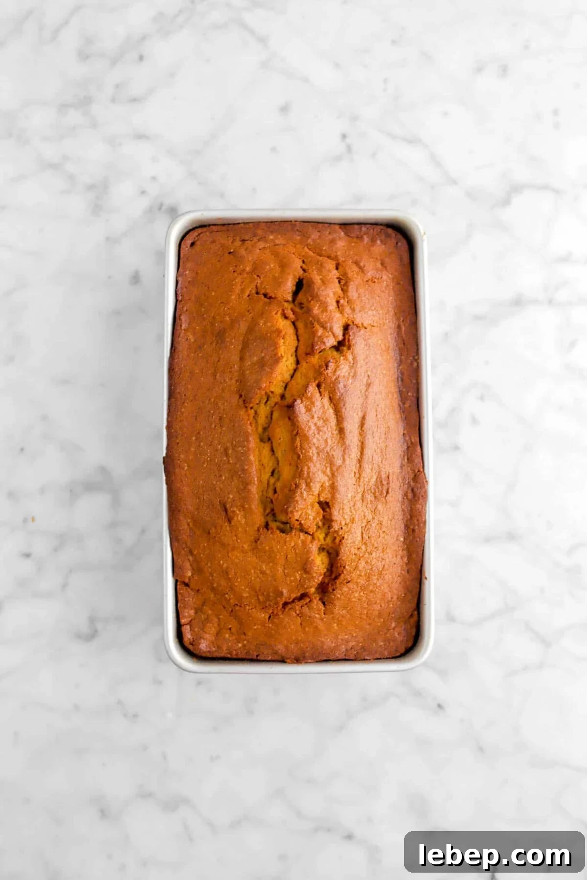 Moist Pumpkin Bread Recipe with Warm Spices 16 baked pumpkin bread in a loaf pan
