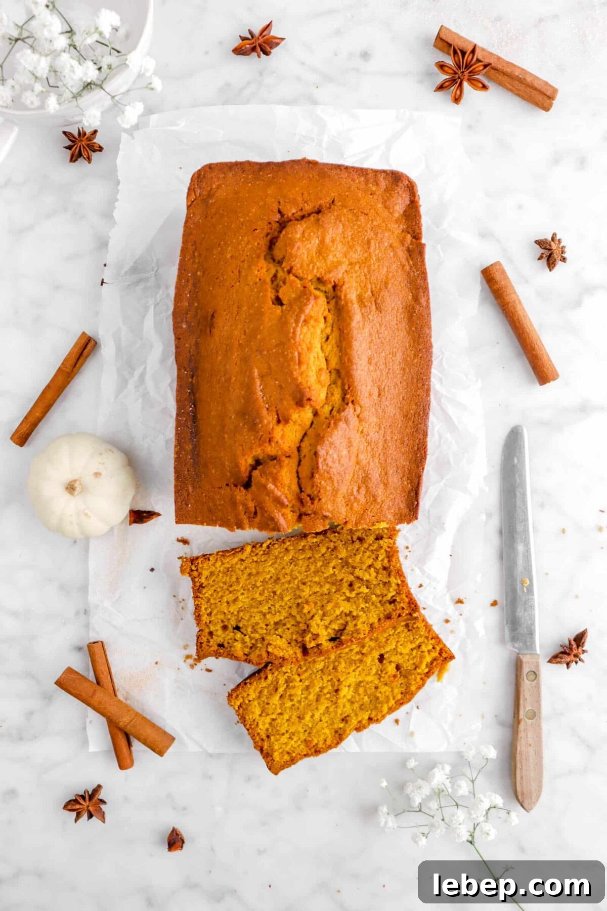 Moist Pumpkin Bread Recipe with Warm Spices 4 overhead photo of pumpkin bread on parchment paper