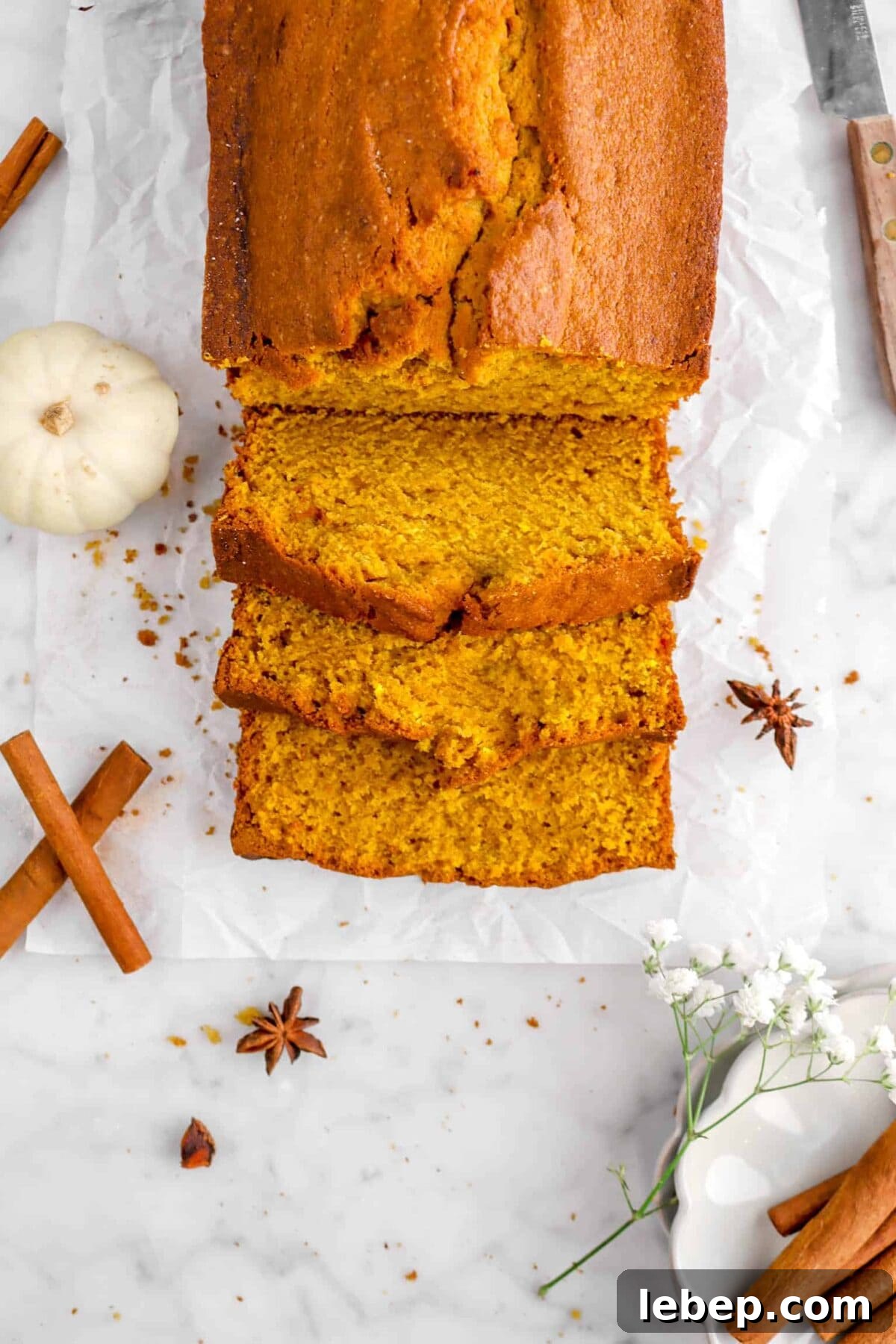 Moist Pumpkin Bread Recipe with Warm Spices 5 close up of three slices of pumpkin bread
