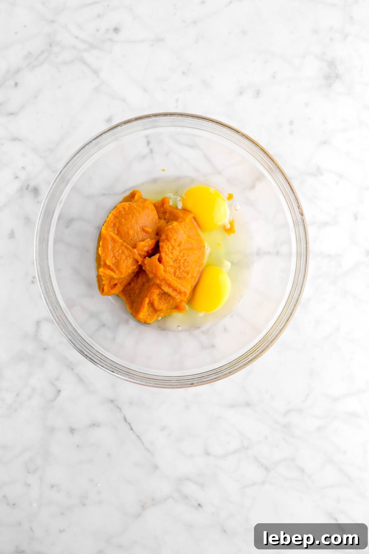 Moist Pumpkin Bread Recipe with Warm Spices 9 pumpkin and eggs in glass bowl