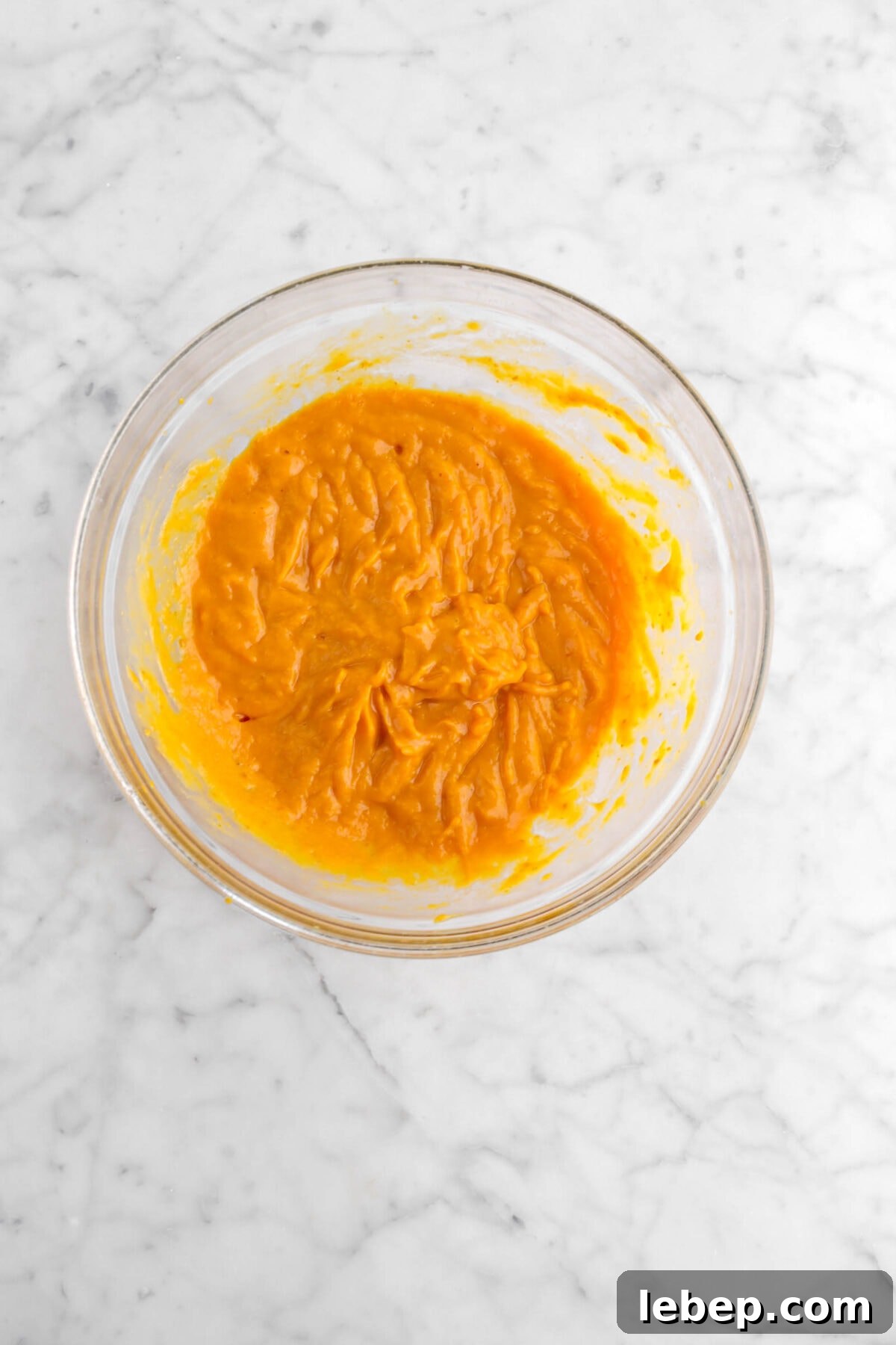 Moist Pumpkin Bread Recipe with Warm Spices 10 pumpkin mixture in glass bowl
