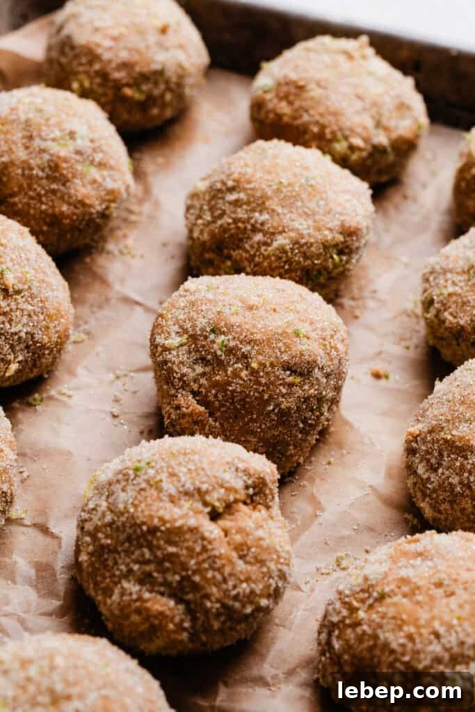 Key Lime Pie Cookies with Make-Ahead Prep Tips 6 A close-up of rows of the dough balls, rolled in lime zested sugar.