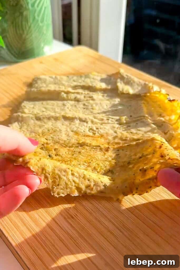 Cooked doner meat on a wooden board.