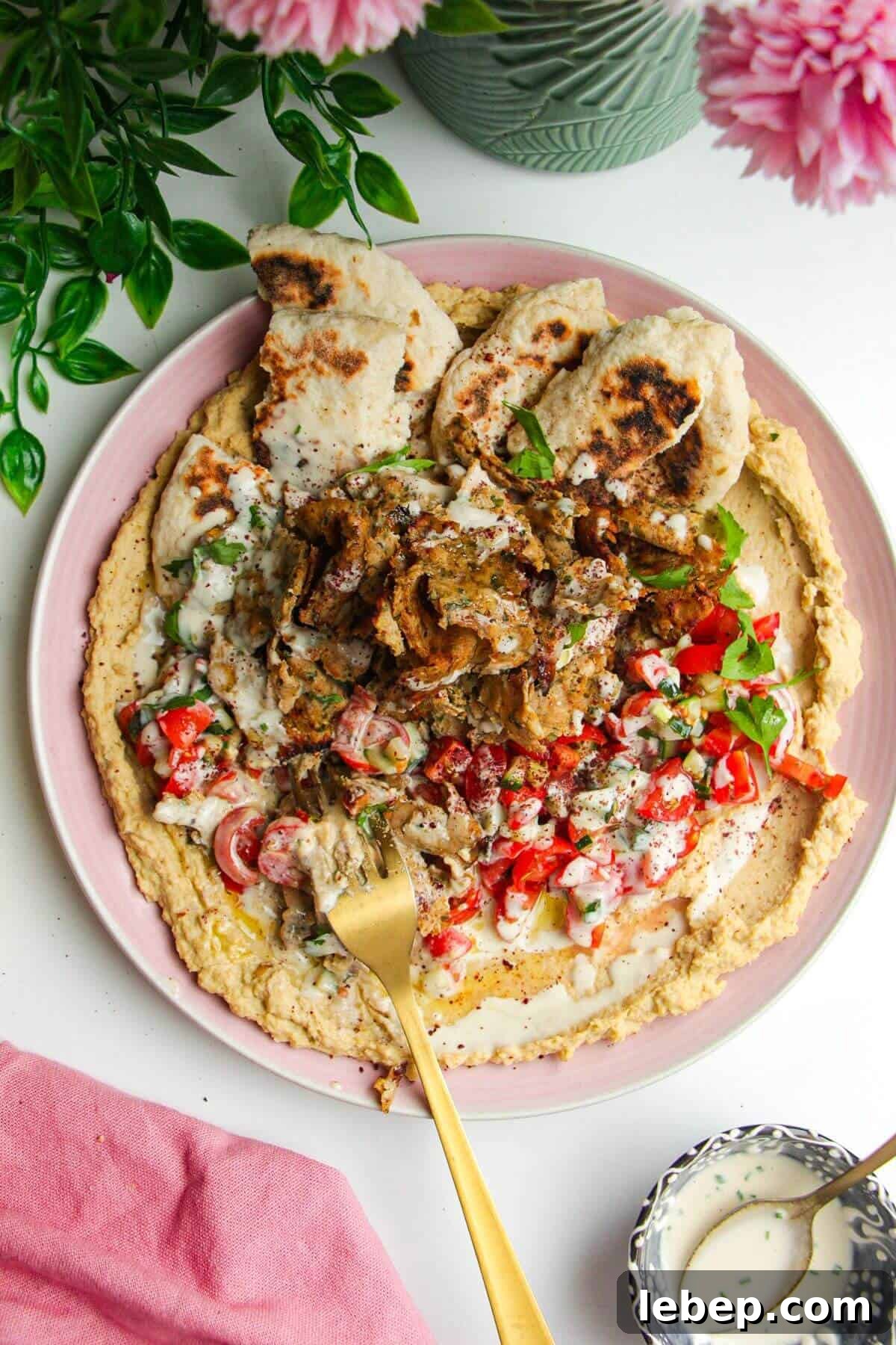 Chicken doner with salad, flatbreads and hummus.