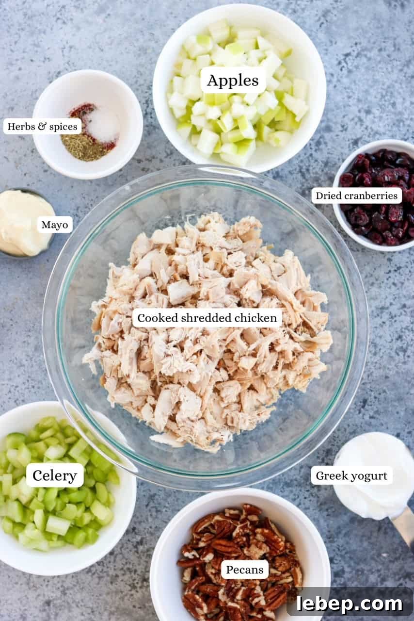 ingredients for cranberry pecan chicken salad in nesting bowls
