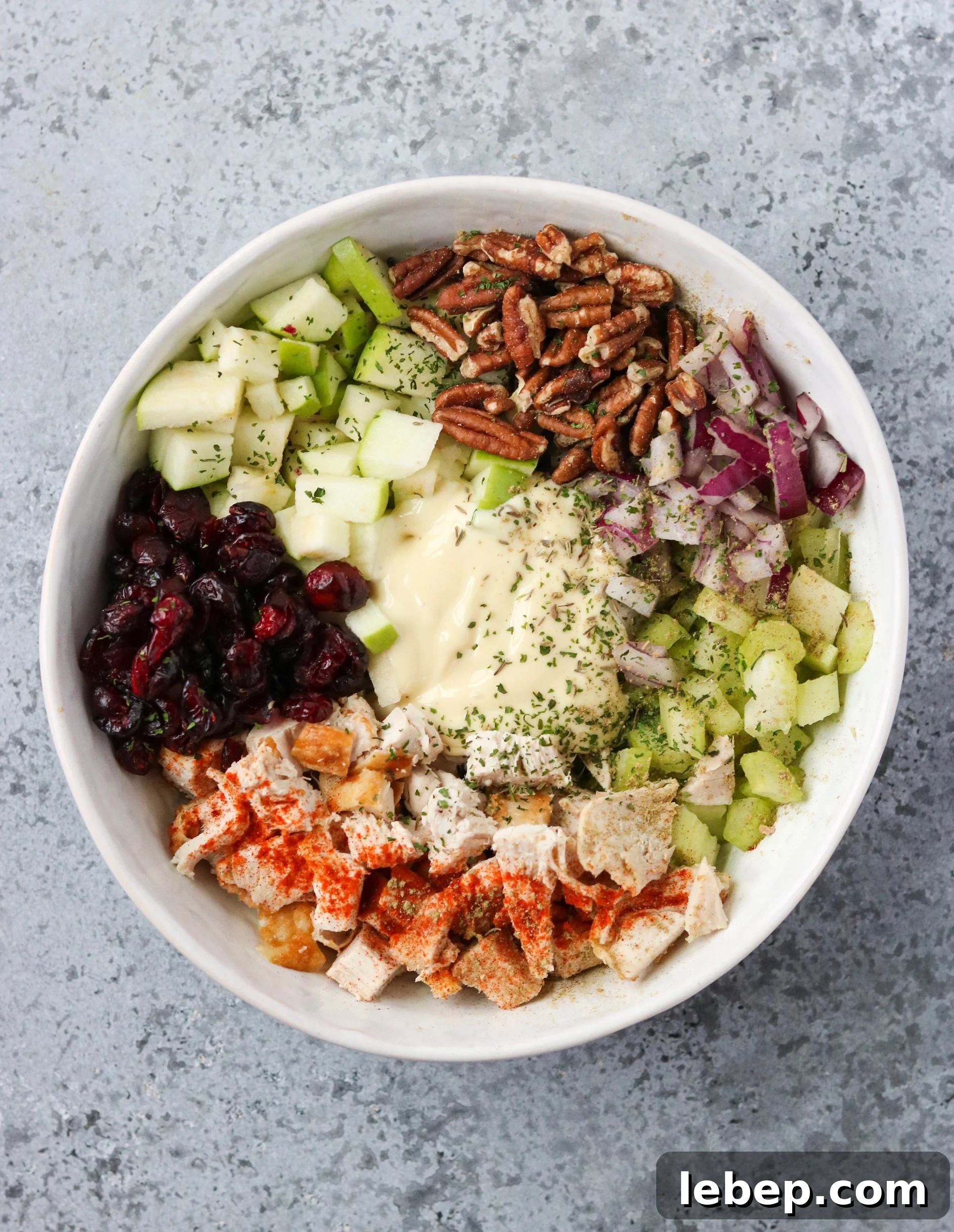 ingredients for cranberry pecan chicken salad in a bowl 