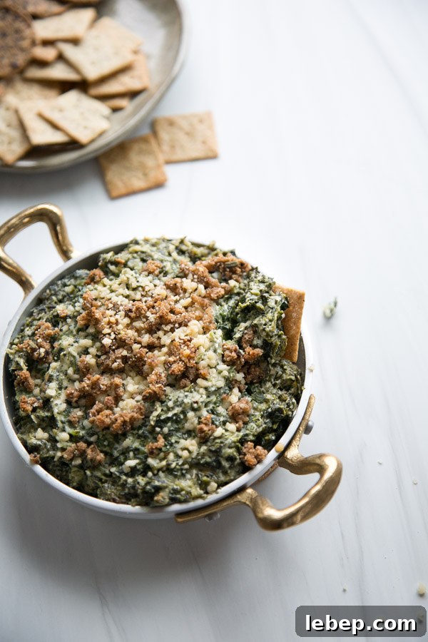 Creamy Warm Spinach Dip — Dairy- and Gluten-Free Recipe 17 baked dairy-free spinach dip with gluten-free cracker in the skillet
