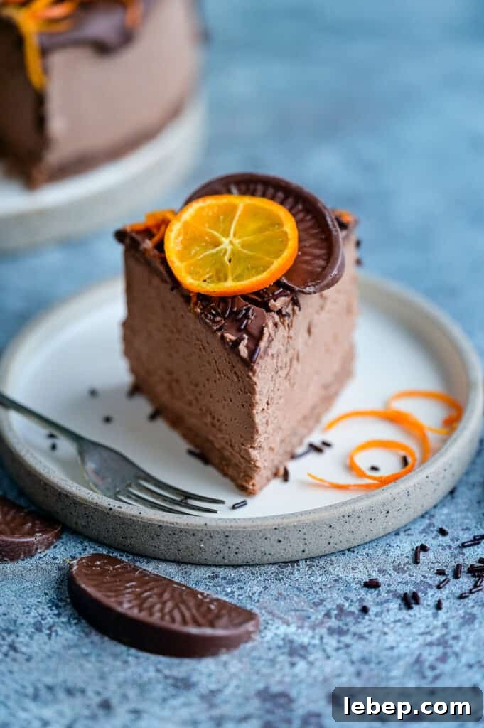 Slice of chocolate orange cheesecake on a plate