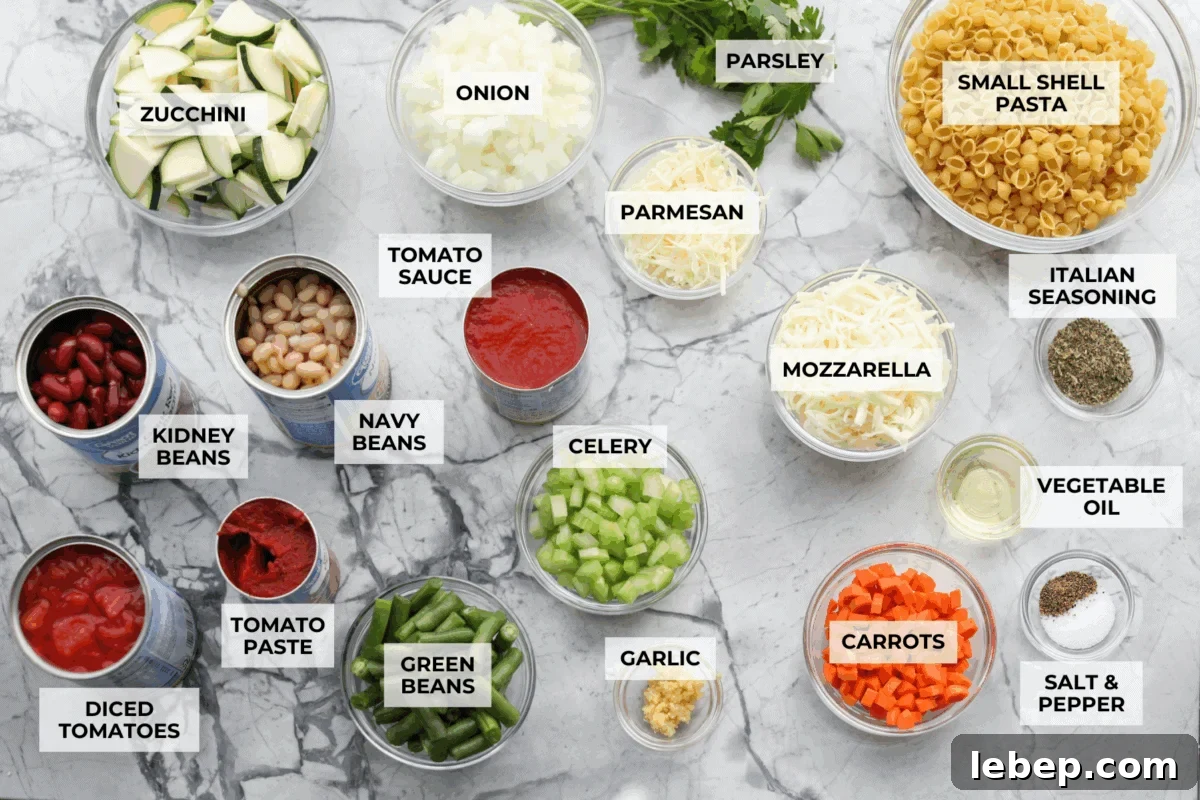 If you love my minestrone soup even a little, you have to try this minestrone casserole. It takes the cozy, veggie packed soup you already love and turns it into a hearty, cheesy pasta bake. It feels like weeknight dinner perfection. Overhead shot of labeled minestrone casserole ingredients.