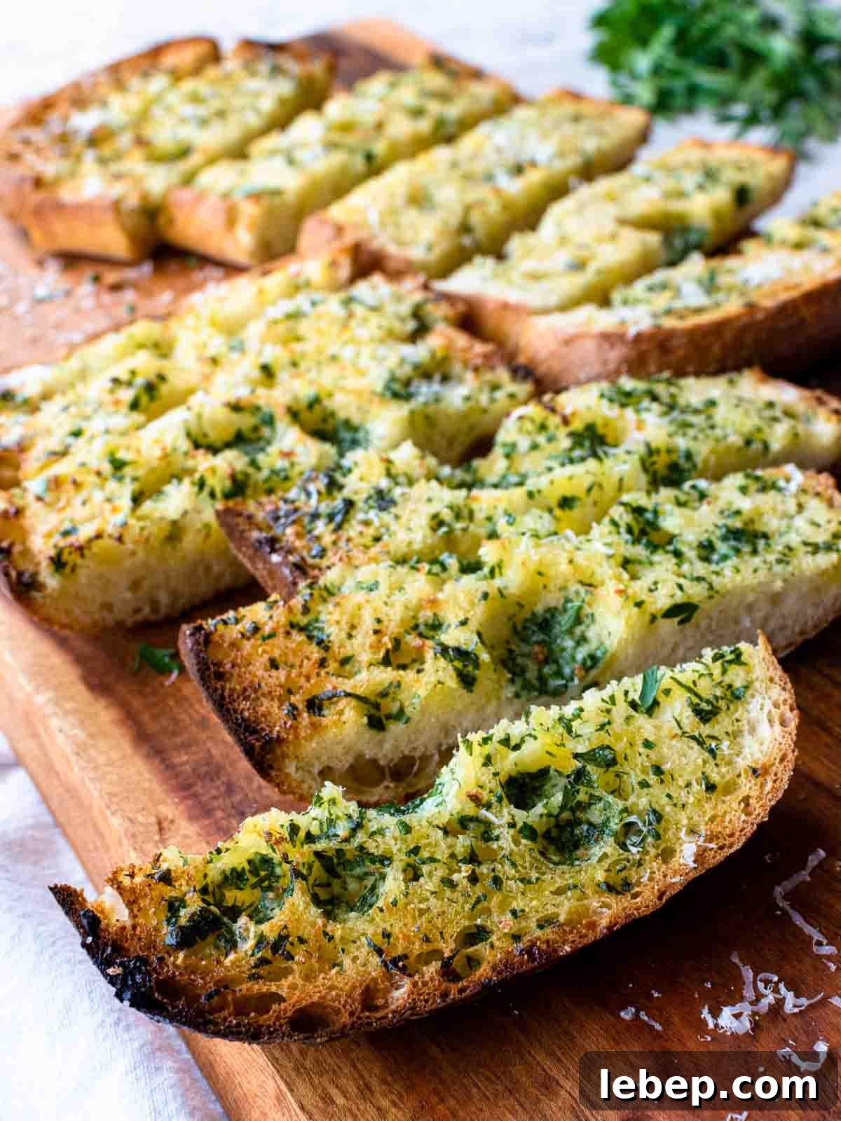 Crispy Ciabatta Garlic Bread Recipe with Herb Butter 2 Slices of toasted ciabatta garlic bread topped with herbs.