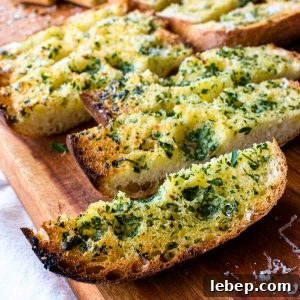 Crispy Ciabatta Garlic Bread Recipe with Herb Butter 7 slice of toasted ciabatta bread topped with herbs.