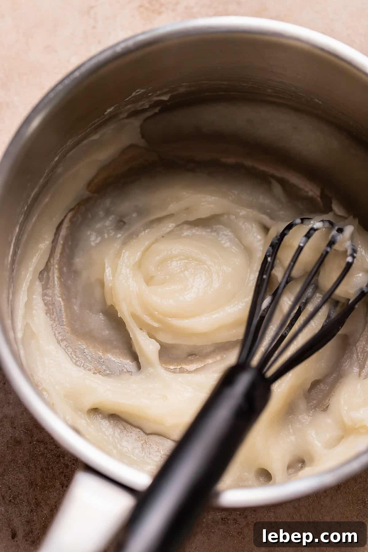 Salted Caramel Donuts with Shiny Caramel Glaze 3 Tangzhong being whisked in a pot.