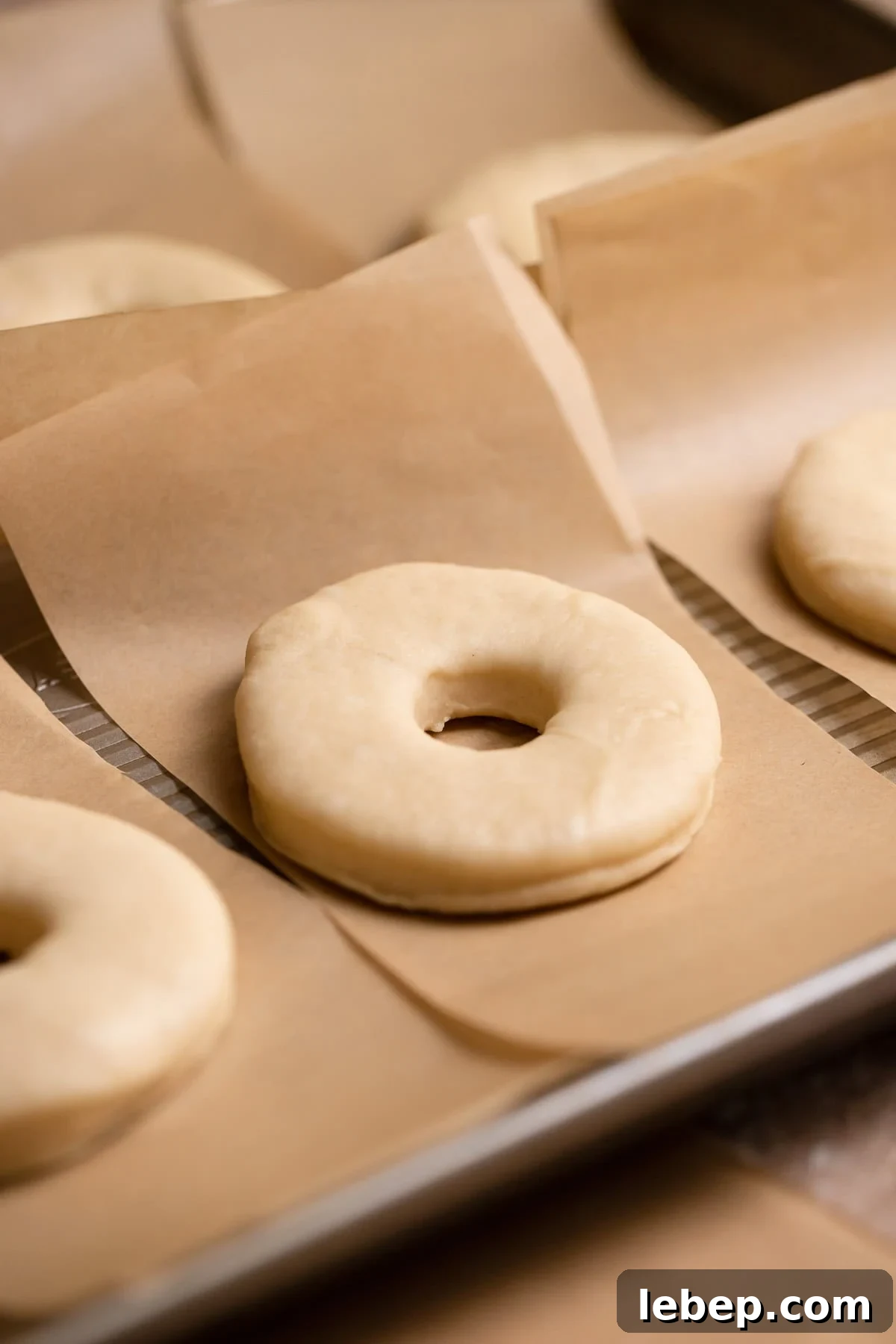 Salted Caramel Donuts with Shiny Caramel Glaze 7 Donuts on individual parchment squares before they double in size.