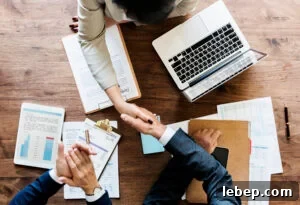 Business people shaking hands together