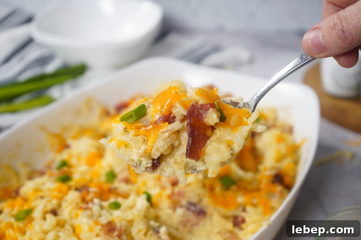 Cheesy potatoes on spoon