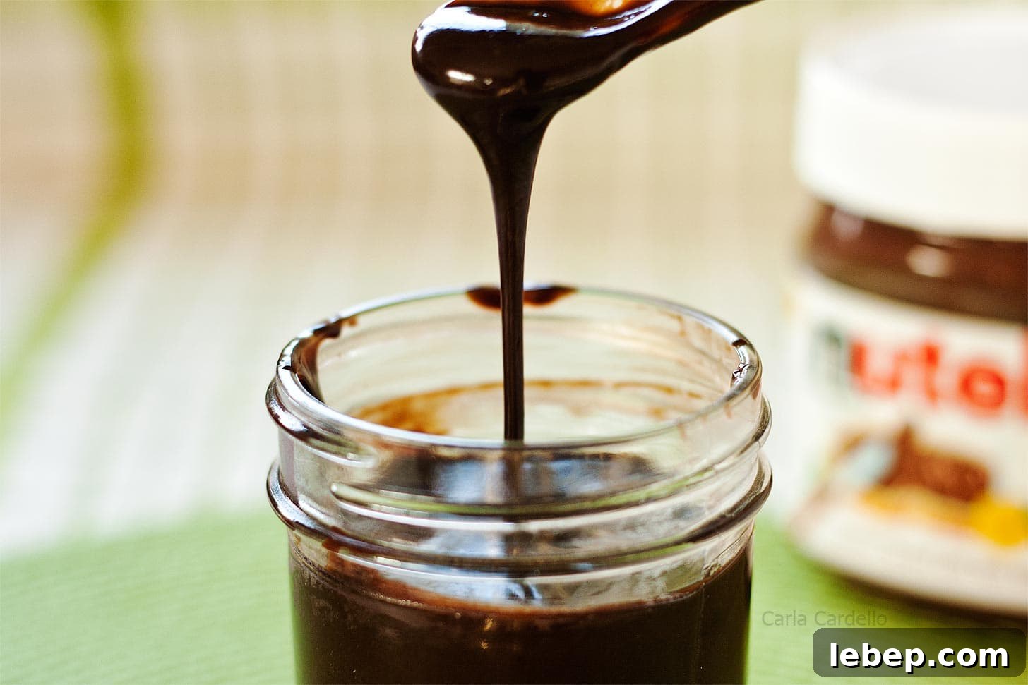 Nutella Sauce drizzling back into its jar
