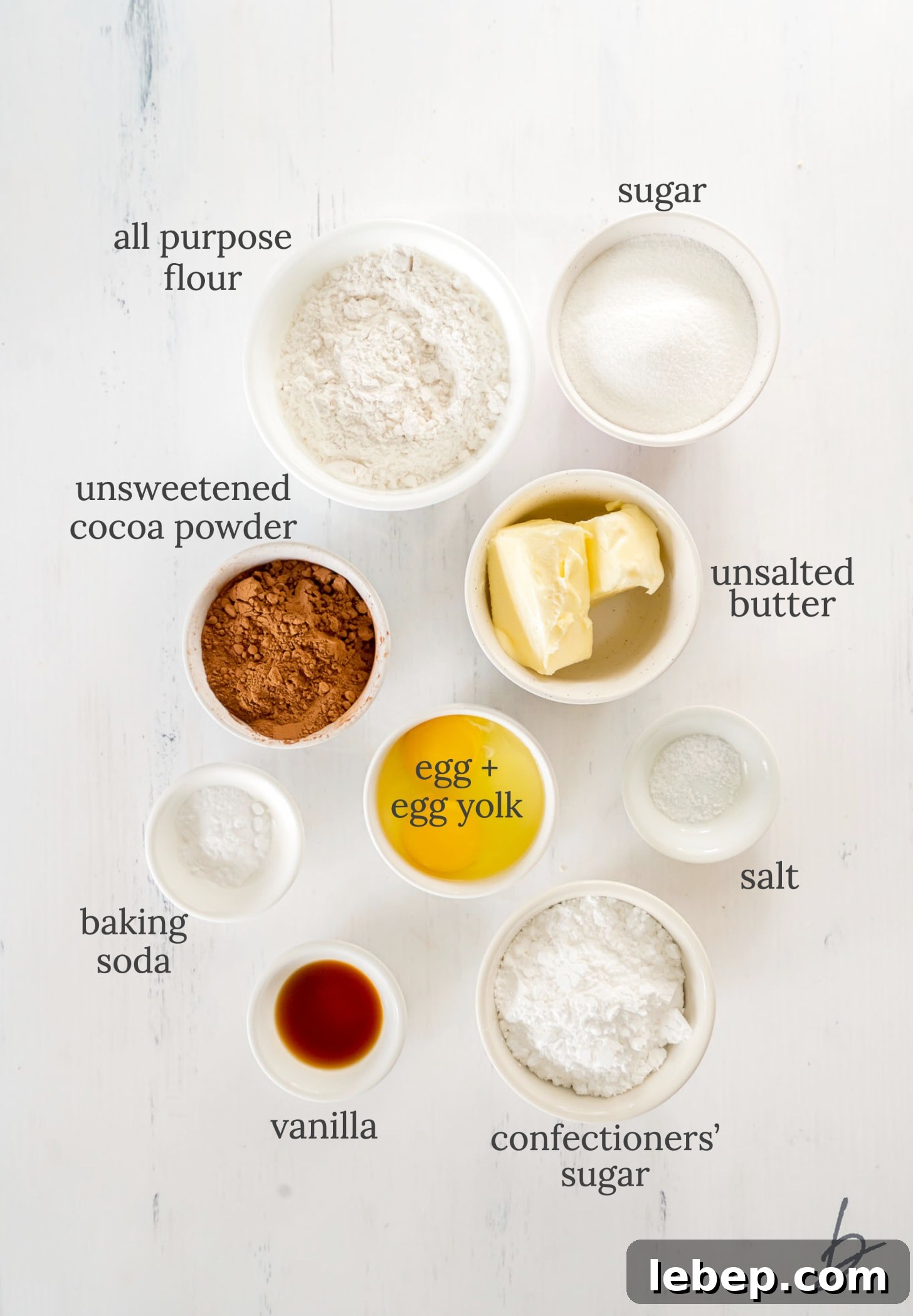 Chocolate Crinkle Cookies Recipe — Soft Fudgy Cookies in Minutes 3 chocolate crinkle cookies ingredients in bowls labeled with text