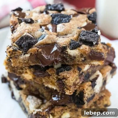 These Oreo cookies and cream bars are a chewy brown sugar blondie base loaded with white and dark chocolate and plenty of Oreo cookies. It's a quick and easy dessert that's sure to please any crowd.