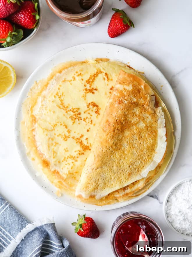 a stack of homemade crepes on a plate