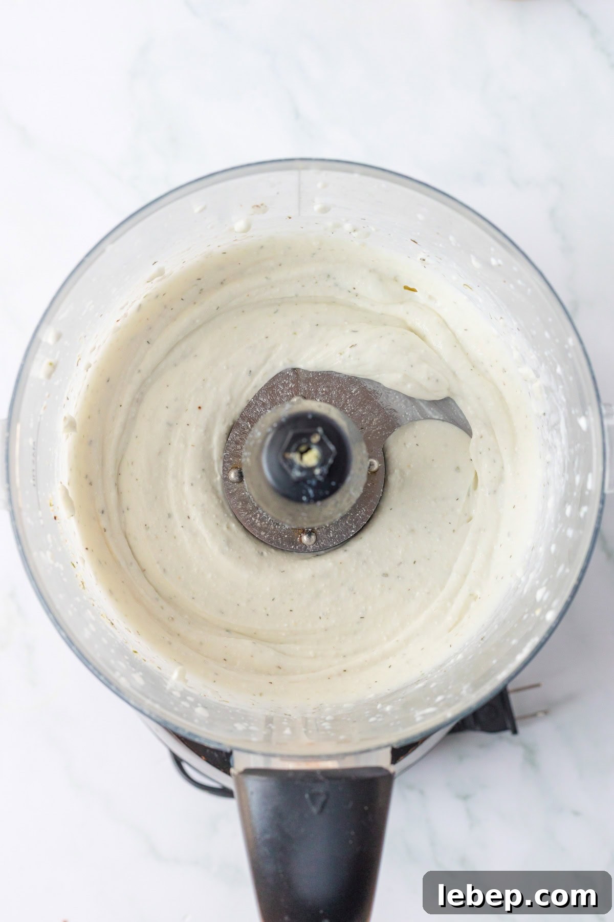 Creamy Cottage Cheese Ranch Dip Recipe for Parties and Snacks 6 An overhead image of smooth and creamy cottage cheese ranch dip in a blender.