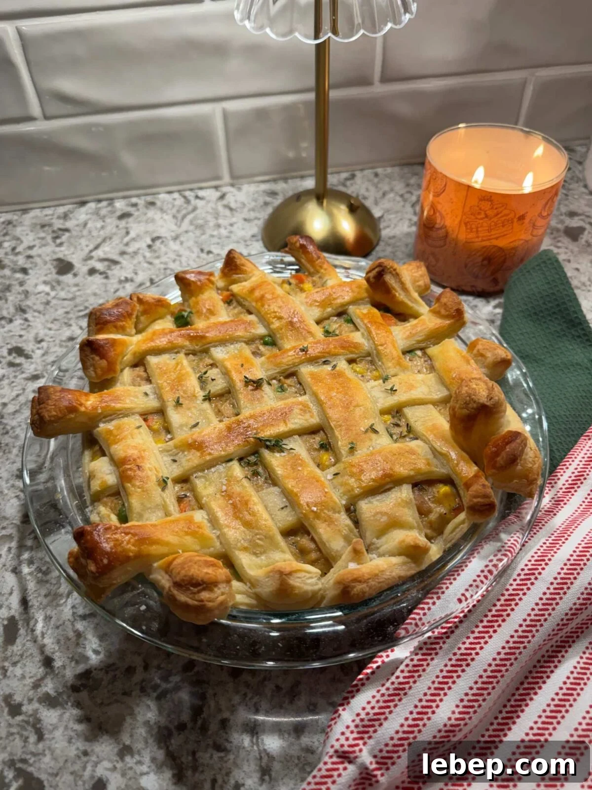 chicken pot pie with puff pastry in a 9 inch baking dish