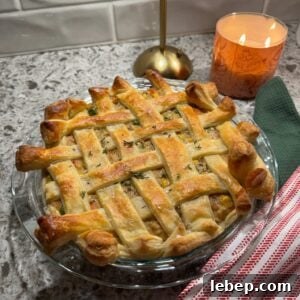 chicken pot pie with puff pastry in a 9 inch baking dish