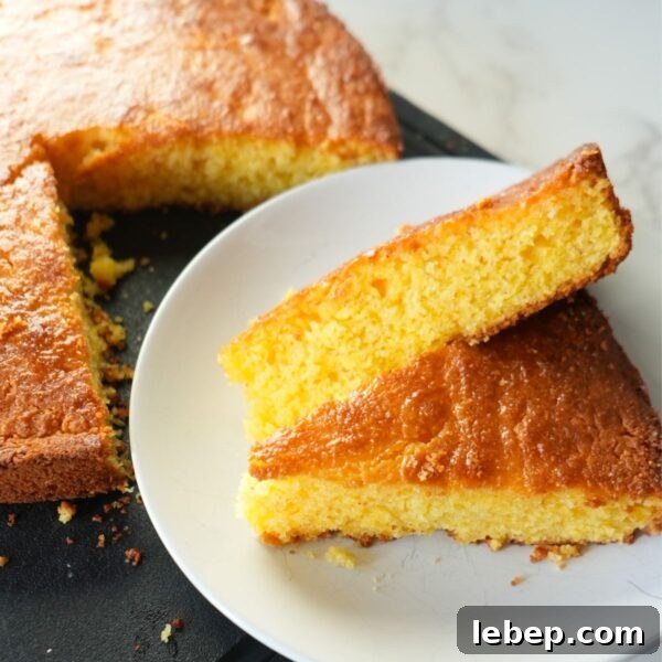 Moist and fluffy Jiffy cornbread topped with melted butter and honey.