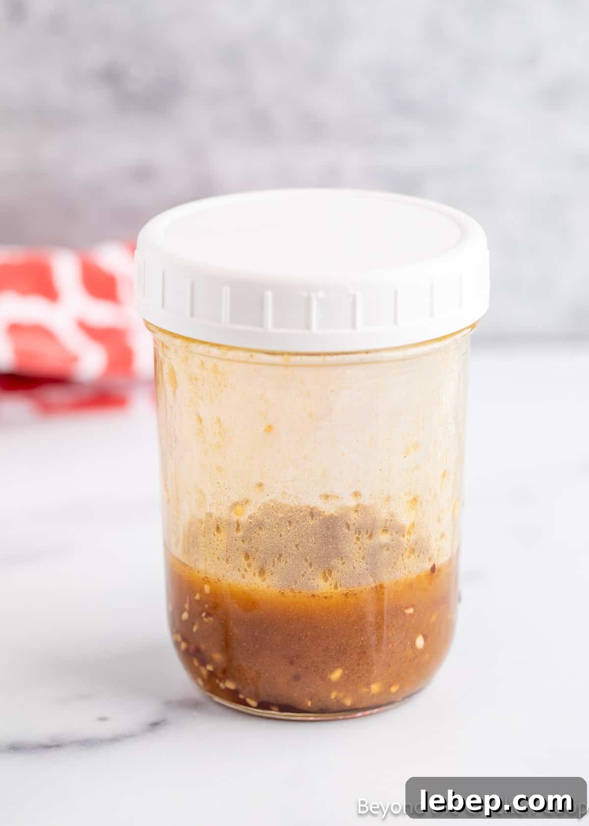 Crispy Asian Chicken Salad with Sesame Ginger Dressing 6 A homemade dressing in a canning jar.