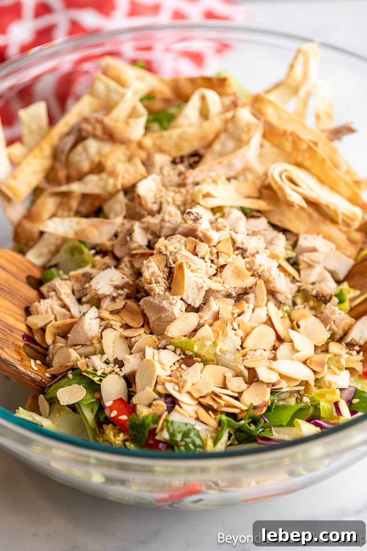 Crispy Asian Chicken Salad with Sesame Ginger Dressing 9 Chopped chicken added to a salad.