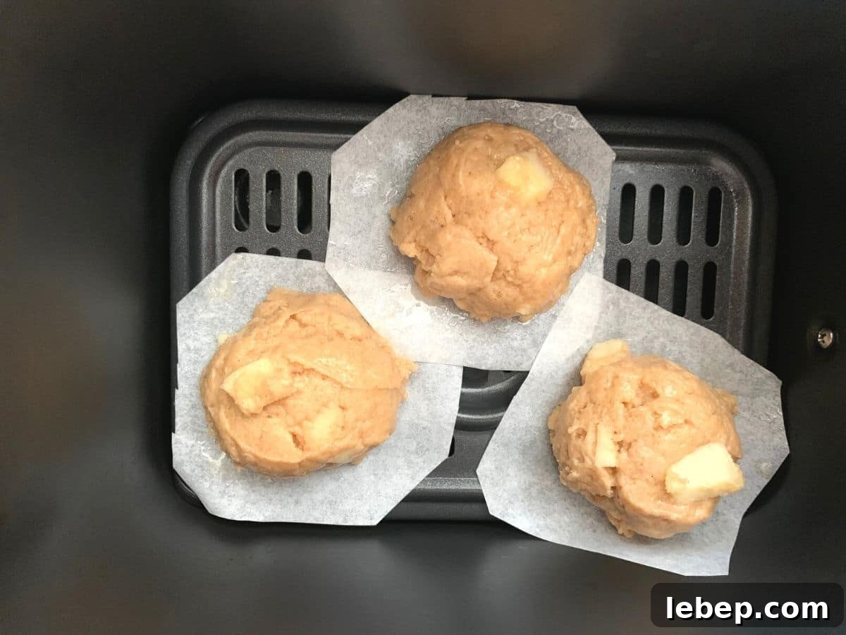 Gluten-Free Apple Fritters: Air Fryer or Classic Fried Recipe 8 A photo of the apple fritter dough balls in the air fryer.