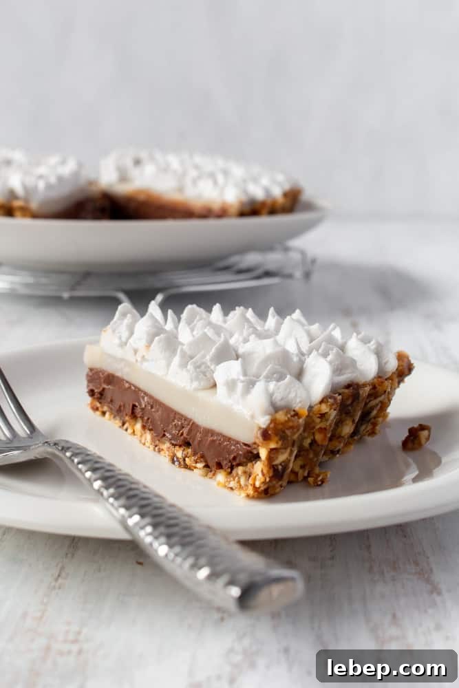 Chocolate Haupia Pie Recipe — Creamy Hawaiian Coconut Dessert 2 A slice of chocolate haupie pie on a plate.