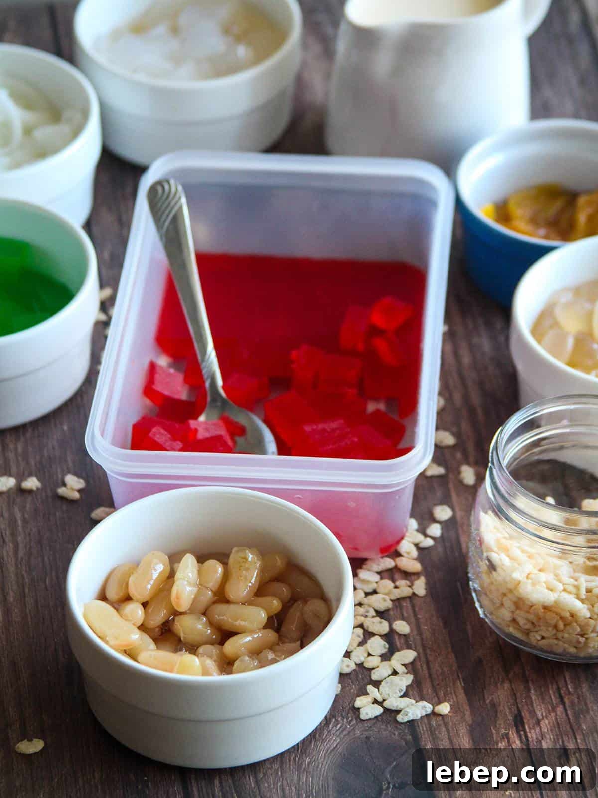 Halo-Halo: The Filipino Dessert Guide to Layers, Ingredients & Tips 4 gulaman, beans, pinipig, macapuno, kaong in individual bowls