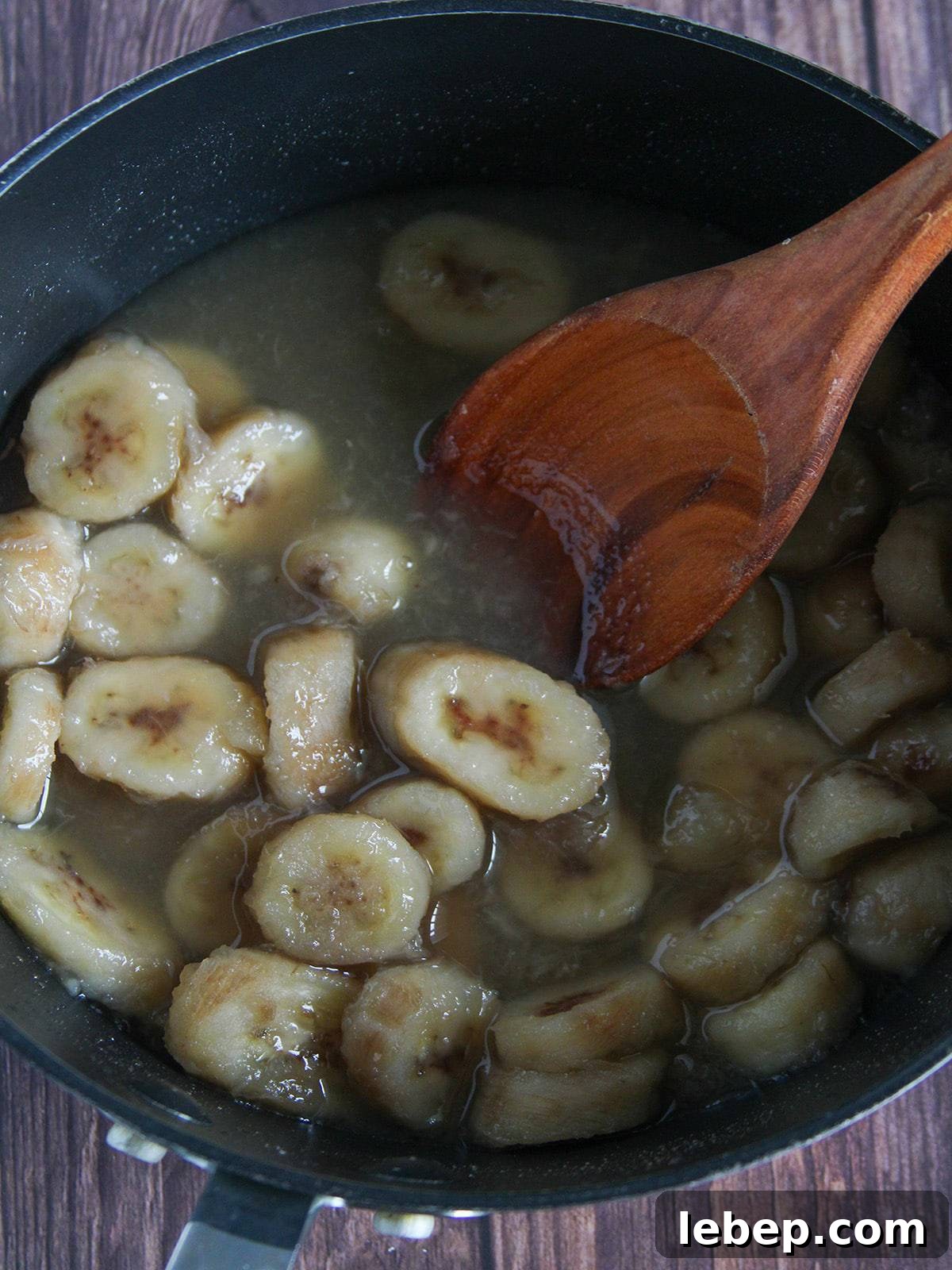 Halo-Halo: The Filipino Dessert Guide to Layers, Ingredients & Tips 6 cooking sweetened saba bananas in a pan