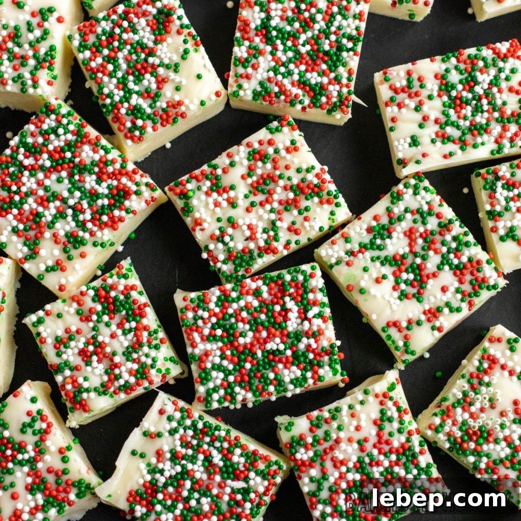 christmas cookie fudge recipe cut into pieces on a cutting board