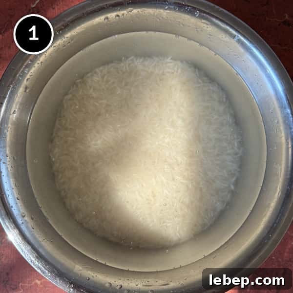 Rice being soaked in water for Indian Jeera Rice