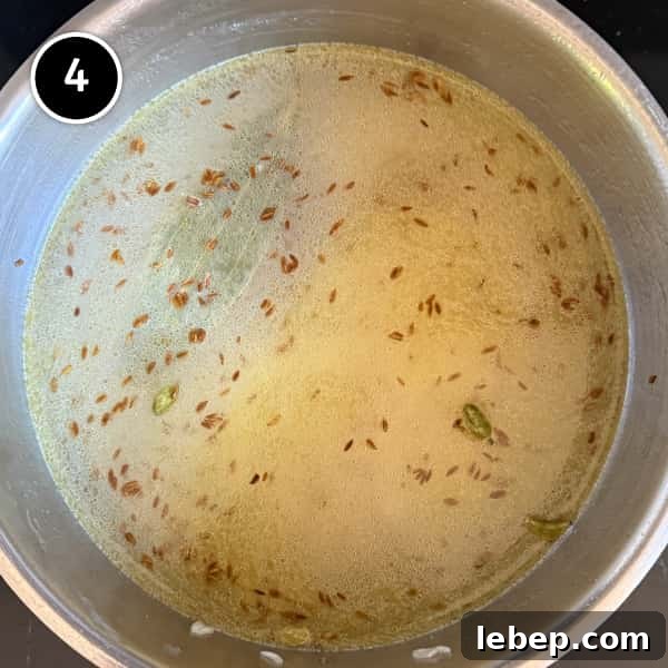 Indian Jeera Rice (Cumin Rice) gently simmering in water