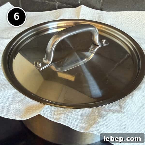 The lid on a pot holding Indian Jeera Rice (Cumin Rice)