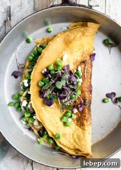 Chickpea omelette with spinach and spring peas