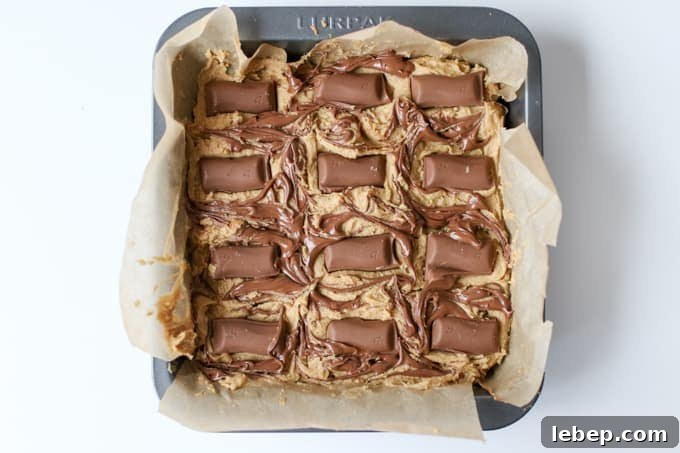 Completely indulgent, these chocolate caramel blondies with swirls of Nutella hit the spot like nothing else!