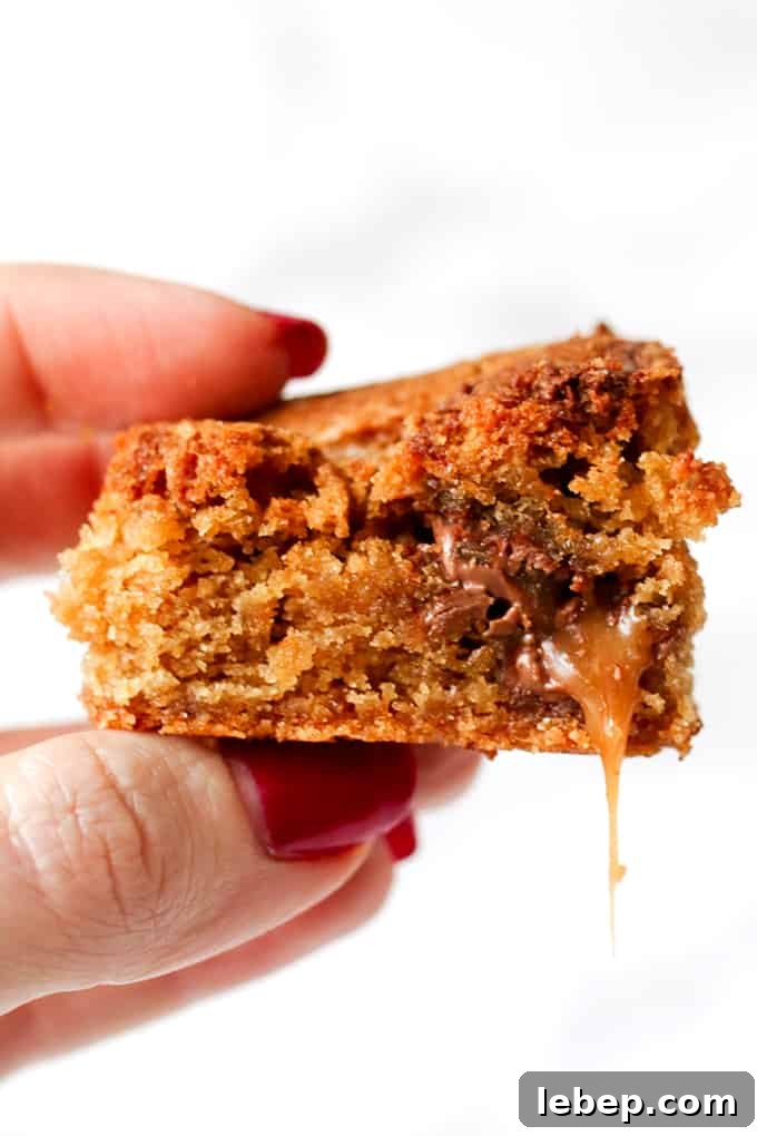 Completely indulgent, these chocolate caramel blondies with swirls of Nutella hit the spot like nothing else!