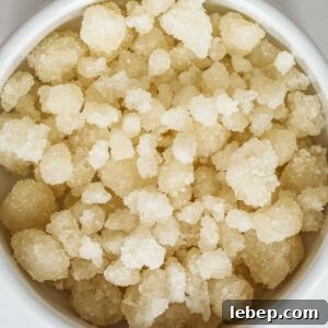 Homemade sugar pearls already dry in a white bowl.