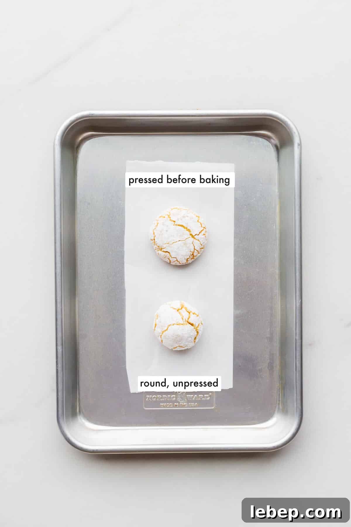 Orange Almond Amaretti Cookies Recipe — Zesty, Chewy Biscotti-Style Treats 11 Comparing an amaretti cookie that was pressed down to flatten it before baking with an amaretti that was left round before baking to show how they turn out.