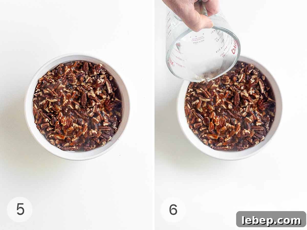 Pecan Pie Cobbler Recipe: Southern-Styled Gooey Pecan Dessert 7 Pecans on top of a baking dish and hot water being poured over the top.