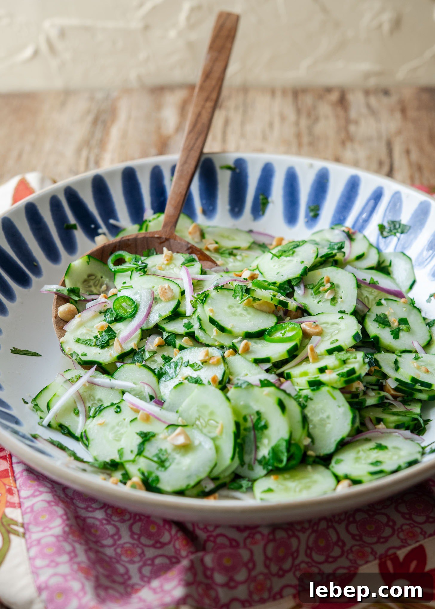 Cucumber salad in a large serving bowl.
