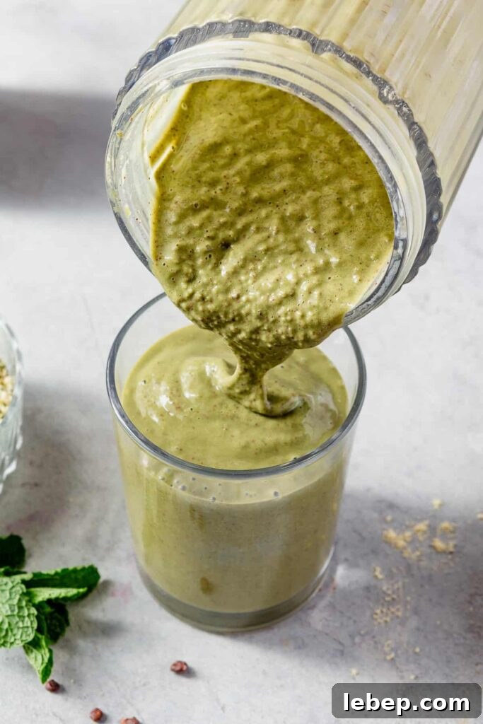 Glass of thin mint smoothie with cacao nibs