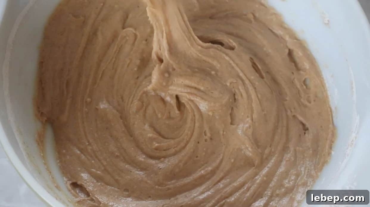 Gingerbread Muffins Recipe with Warm Spices and Molasses 4 Gingerbread muffin batter in mixing bowl.